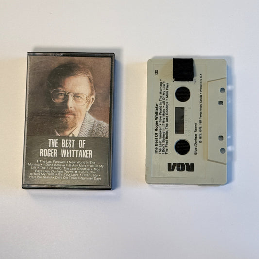 The Best of Roger Whittaker gray cassette wallet with a black pull tab beside the original case