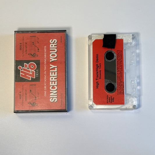 Sincerely Yours high-track demo clear cassette wallet with a black pull tab beside the red Hi-Lo Trax case