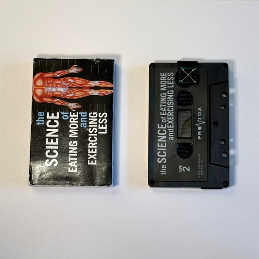 Black The Science of Eating More and Exercising Less cassette wallet with a black pull tab and original sleeve